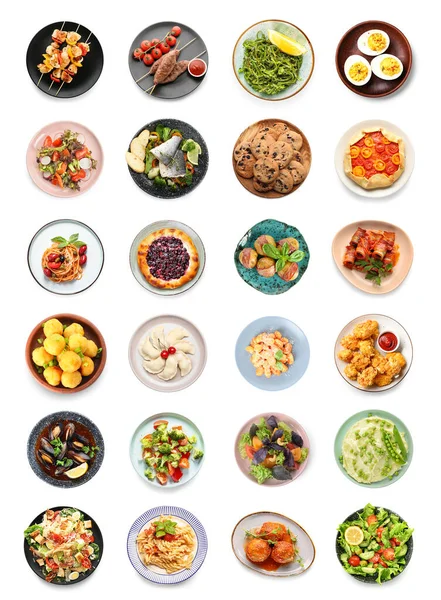 Collection of plates with tasty dishes on white background