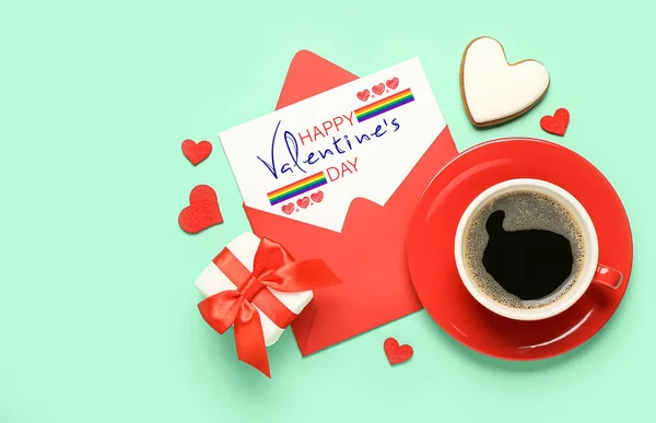 Envelope, gift, coffee and cookie on green background. Valentine\'s Day celebration