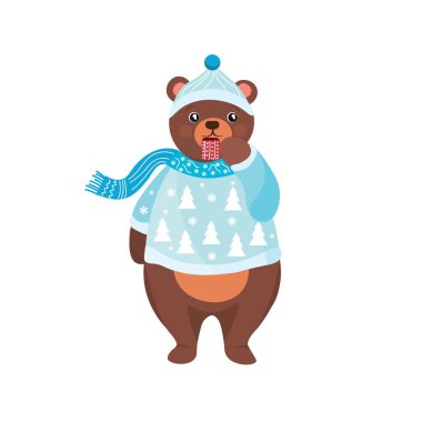 Noel kıyafetleri içinde sevimli bir ayı ve beyaz arka planda bir fincan sıcak çikolatayla