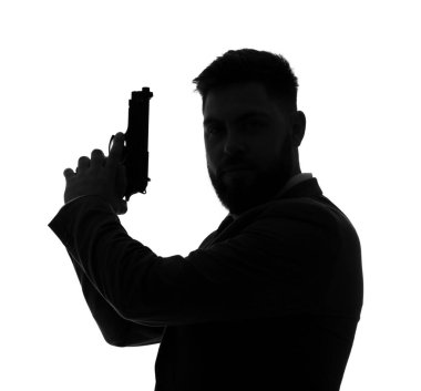 Beyaz arka planda silahı olan genç bir adamın silueti.