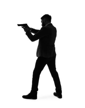 Beyaz arka planda silahı olan genç bir adamın silueti.