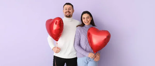 Happy Couple Balloons Shape Hearts Lilac Background Valentine Day Celebration — Stock Photo, Image