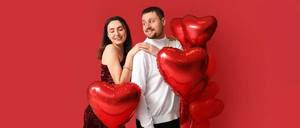 Happy Couple Balloons Shape Hearts Red Background Valentine Day Celebration — Stock Photo, Image