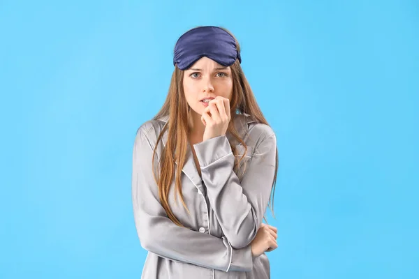 Young Woman Pajamas Biting Nails Blue Background — Stock Photo, Image