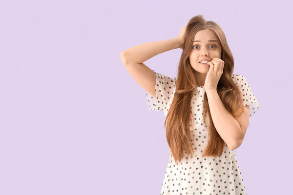 Young Woman Biting Nails Lilac Background — Stock Photo, Image