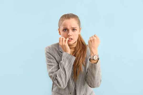 Young Businesswoman Wristwatch Biting Nails Blue Background — Stock Photo, Image