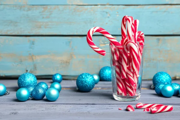 Glass Tasty Candy Canes Christmas Balls Color Wooden Background — Stock Photo, Image