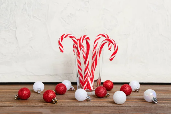 Glass Tasty Candy Canes Christmas Balls Wooden Table — Stock Photo, Image