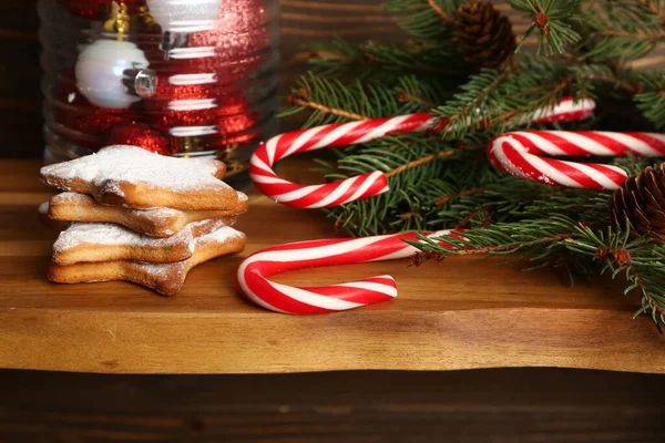 Tasty Candy Canes Cookies Fir Branches Wooden Table Closeup — Stock Photo, Image