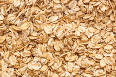 Arkaplan olarak çiğ yulaf taneleri, yakın plan