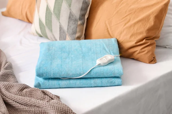 Folded Electric Heating Pad Controller Bed Room Closeup — Stock Photo, Image