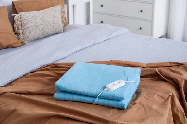 Folded Electric Heating Pad Controller Bed Room Closeup — Stock Photo, Image