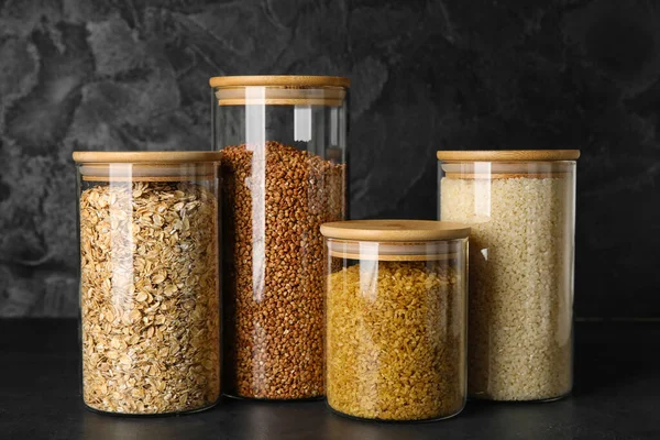 Glass Jars Different Cereals Dark Background — Stock Photo, Image