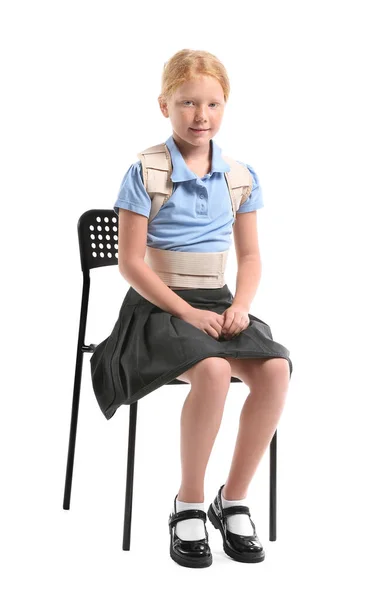Little Schoolgirl Back Brace Sitting White Background — Stock Photo, Image