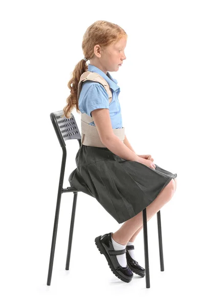 Little Schoolgirl Back Brace Sitting White Background — Stock Photo, Image