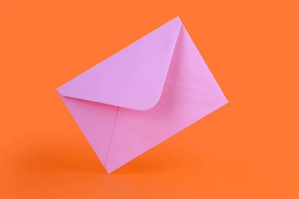 Pink Paper Envelope Orange Background — Stock Photo, Image