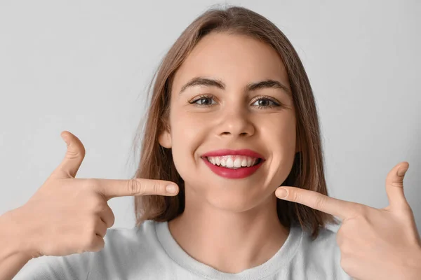 Young Woman Pointing Her Teeth Grey Background Closeup — Stock Photo, Image