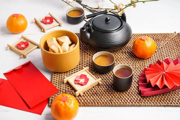 Teapot Fortune Cookies Mandarins Envelopes Chinese Symbols White Wooden Table — Stock Photo, Image