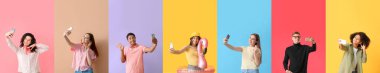 Group of modern people with mobile phones taking selfie on color background