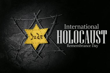 David star and barbed wire on dark background. International Holocaust Remembrance Day
