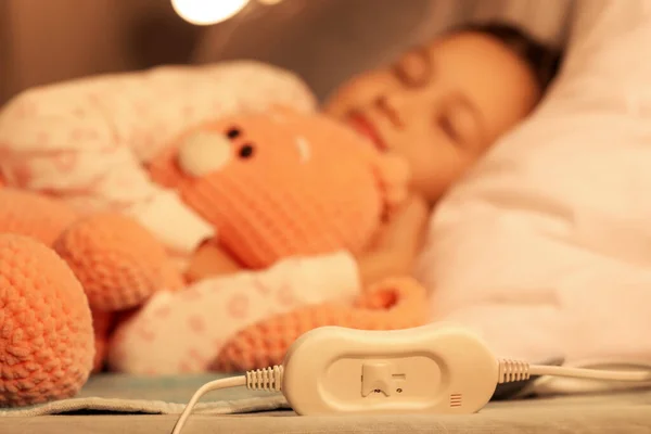 Little Girl Toy Sleeping Electric Heating Pad Bedroom Night — Stock Photo, Image