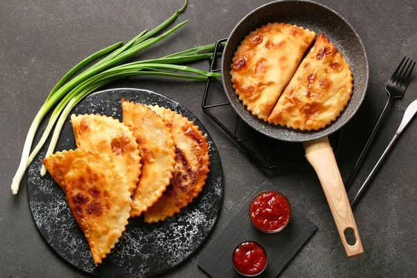 Frying Pan Board Tasty Chebureks Sauces Onion Dark Grunge Background — 스톡 사진