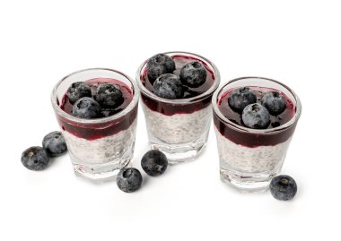 Shots of delicious chia seed pudding with blueberry isolated on white background