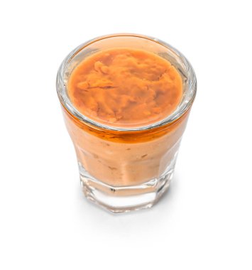 Shot of delicious pudding with jam isolated on white background