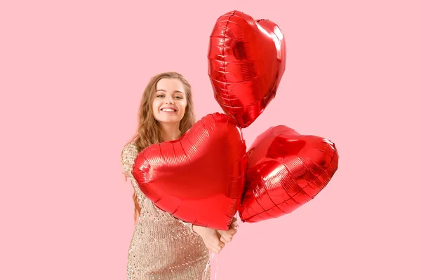 Happy Young Woman Heart Shaped Balloons Pink Background Valentine Day — Fotografia de Stock