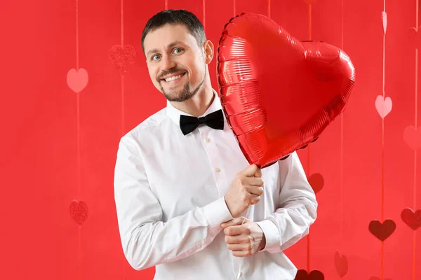 Handsome Man Heart Shaped Balloon Red Background Valentine Day Celebration — Stock Photo, Image