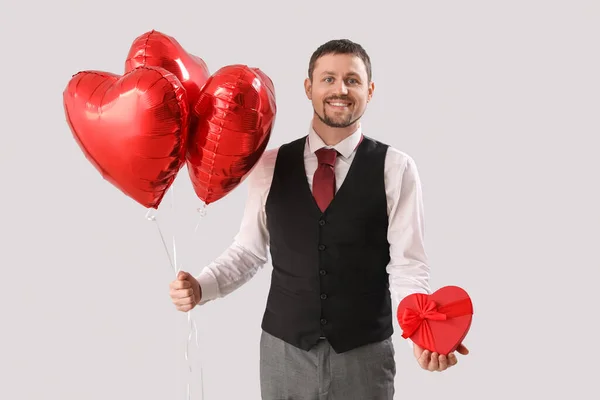 Handsome Man Heart Shaped Balloons Gift Light Background Valentine Day — Stock Photo, Image