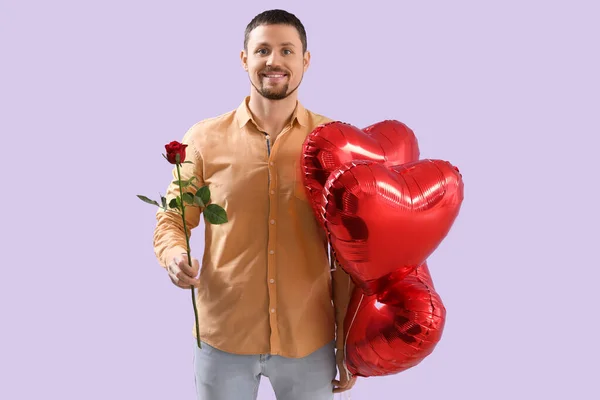 Handsome Man Heart Shaped Balloons Rose Lilac Background Valentine Day — Stock Photo, Image