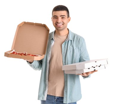 Handsome young man holding boxes with fresh pizza on white background