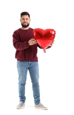 Young bearded man with balloon for Valentine's Day on white background