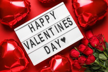 Board with text HAPPY VALENTINE'S DAY, roses and balloons on red background