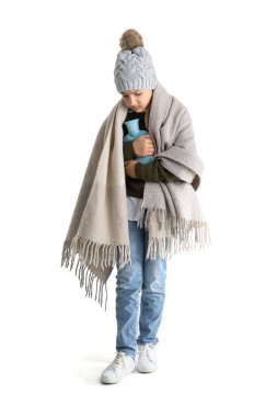 Ill girl with hot water bottle and plaid on white background