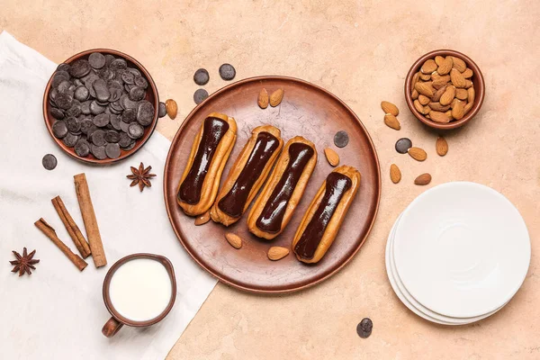 Composition Plate Tasty Eclairs Milk Chocolate Drops Almond Nuts Color — Stock Photo, Image
