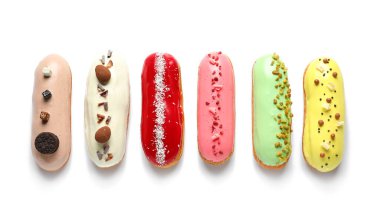Various glazed eclairs isolated on white background