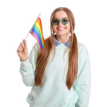 Beautiful young woman in sunglasses with LGBT flag on white background