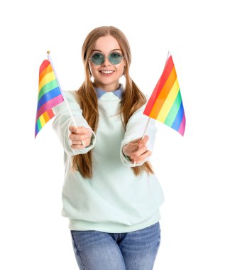 Beautiful young woman in sunglasses with LGBT flags on white background