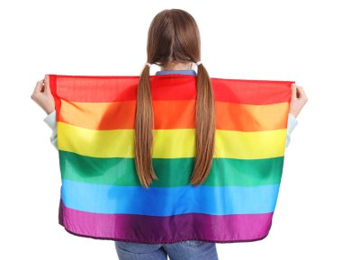 Young woman with ponytails and LGBT flag on white background, back view