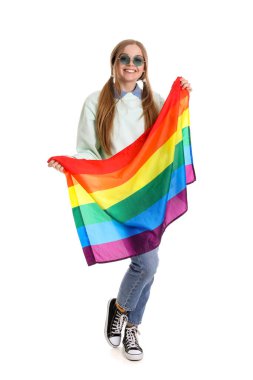 Beautiful young woman in sunglasses with LGBT flag on white background