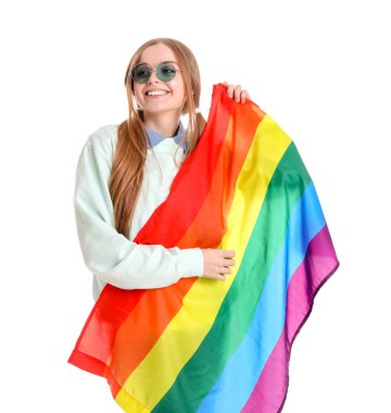 Beautiful young woman in sunglasses with LGBT flag on white background