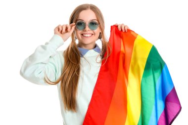 Beautiful young woman in sunglasses with LGBT flag on white background