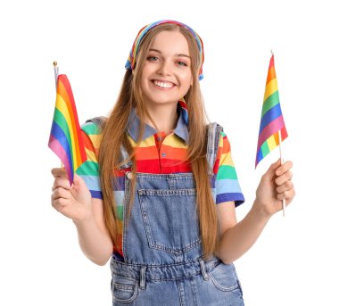 Beautiful young woman with LGBT flags on white background