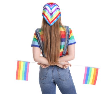 Young woman with LGBT flags on white background, back view