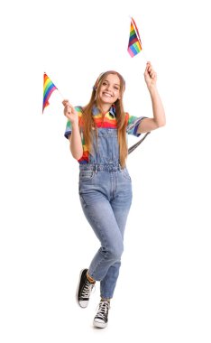 Beautiful young woman with LGBT flags on white background