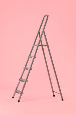 Maintenance ladder on pink background