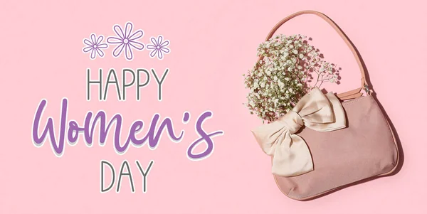 Stylish female handbag, hair bow and beautiful flowers on pink background. Happy Women\'s Day celebration