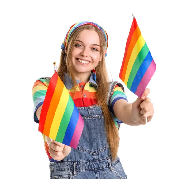 Beautiful young woman with LGBT flags on white background